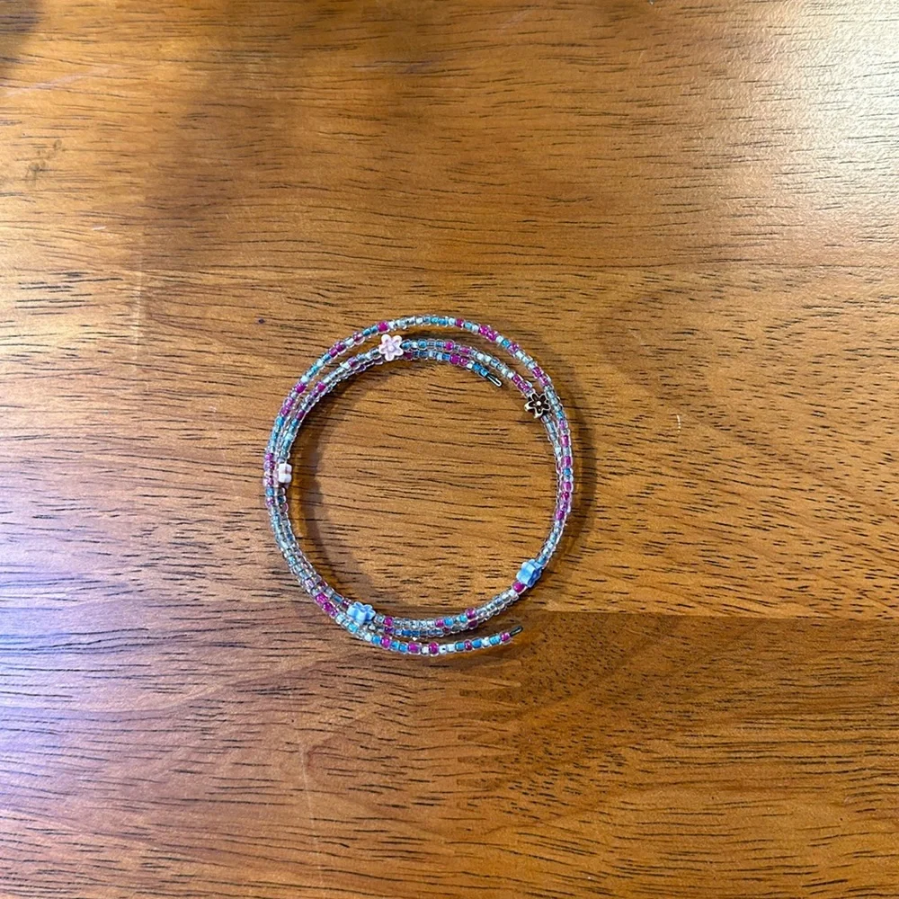 Handmade seed bead bracelet. Stretchy. Pink blue flowers.